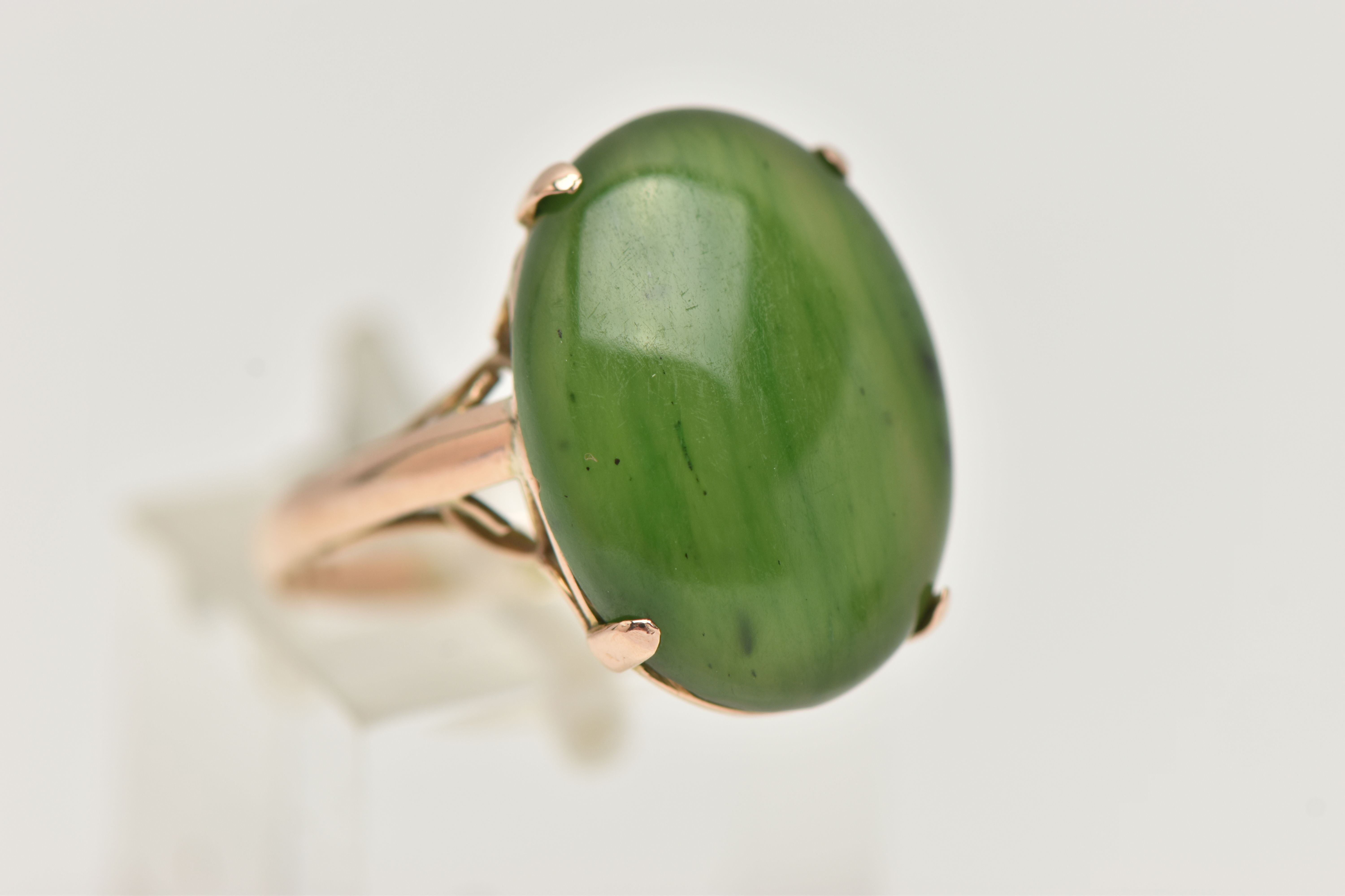 A YELLOW METAL, NEPHRITE CABOCHON RING, of an oval form, nephrite measuring approximately length - Image 4 of 4