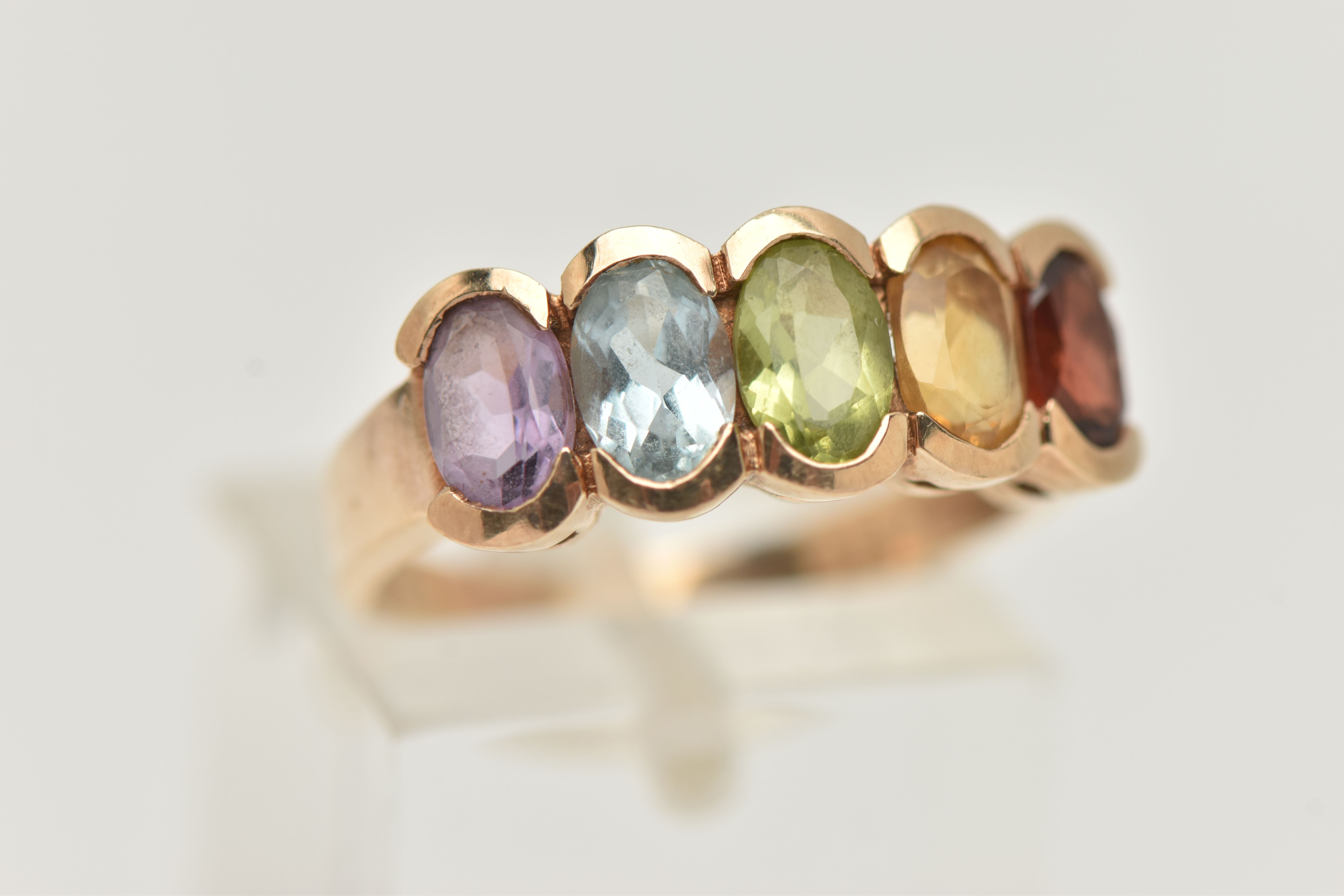 A 9CT GOLD MULTI GEM SET RING, designed as a row of five oval cut stones to include garnet, citrine, - Image 4 of 4