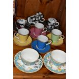 A GROUP OF COFFEE CUPS AND TWO ROYAL WORCESTER 'PRIMULA' TEA CUPS AND SAUCERS, comprising a set of