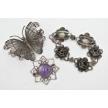 THREE ITEMS OF WHITE METAL JEWELLERY, to include a white metal flower bracelet, stamped 'Sterling,