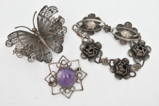 THREE ITEMS OF WHITE METAL JEWELLERY, to include a white metal flower bracelet, stamped 'Sterling,