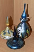 THREE OKRA SCENT BOTTLES, the tallest an iridescent blue with small white flowers, base bears etched