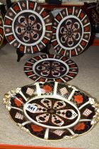 FOUR PIECES OF ROYAL CROWN DERBY OLD IMARI 1128, comprising three 23cm plates and the top of an oval