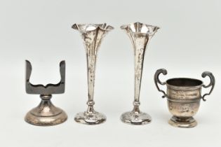 FOUR ITEMS OF SILVERWARE, to include a pair of silver Edwardian bud vases with weighted bases,