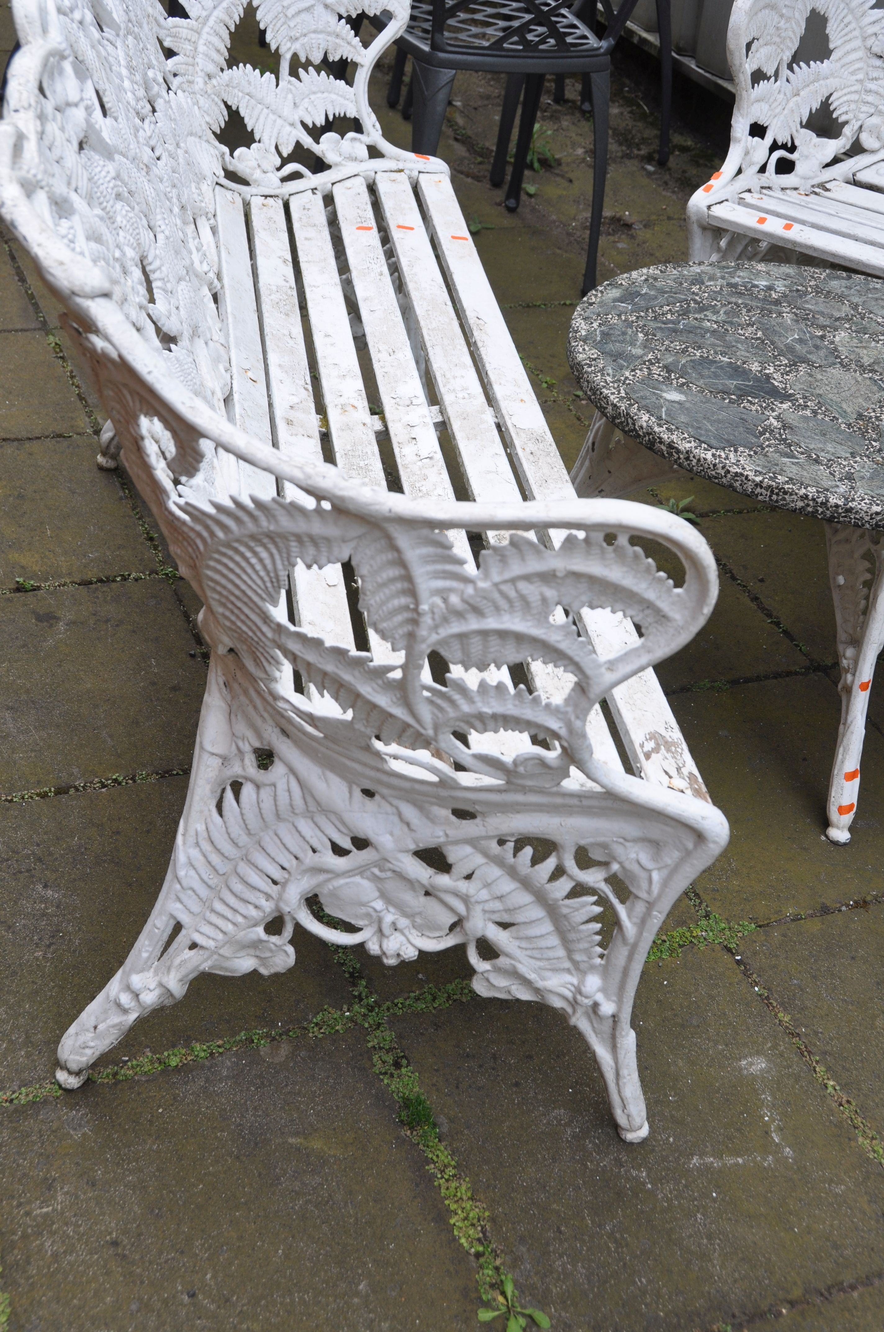 A LATE 20TH CENTURY CAST ALUMINIUM GARDEN SET comprising of a three seat bench and two matching - Image 2 of 4