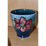 A MOORCROFT POTTERY 'CLEMATIS' PATTERN SMALL PLANTER, of flared form, tube lined with purple/red