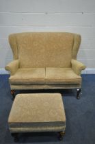 A PARKER KNOLL WING BACK TWO SEATER SOFA, width 136cm x depth 87cm x height 98cm, along with a
