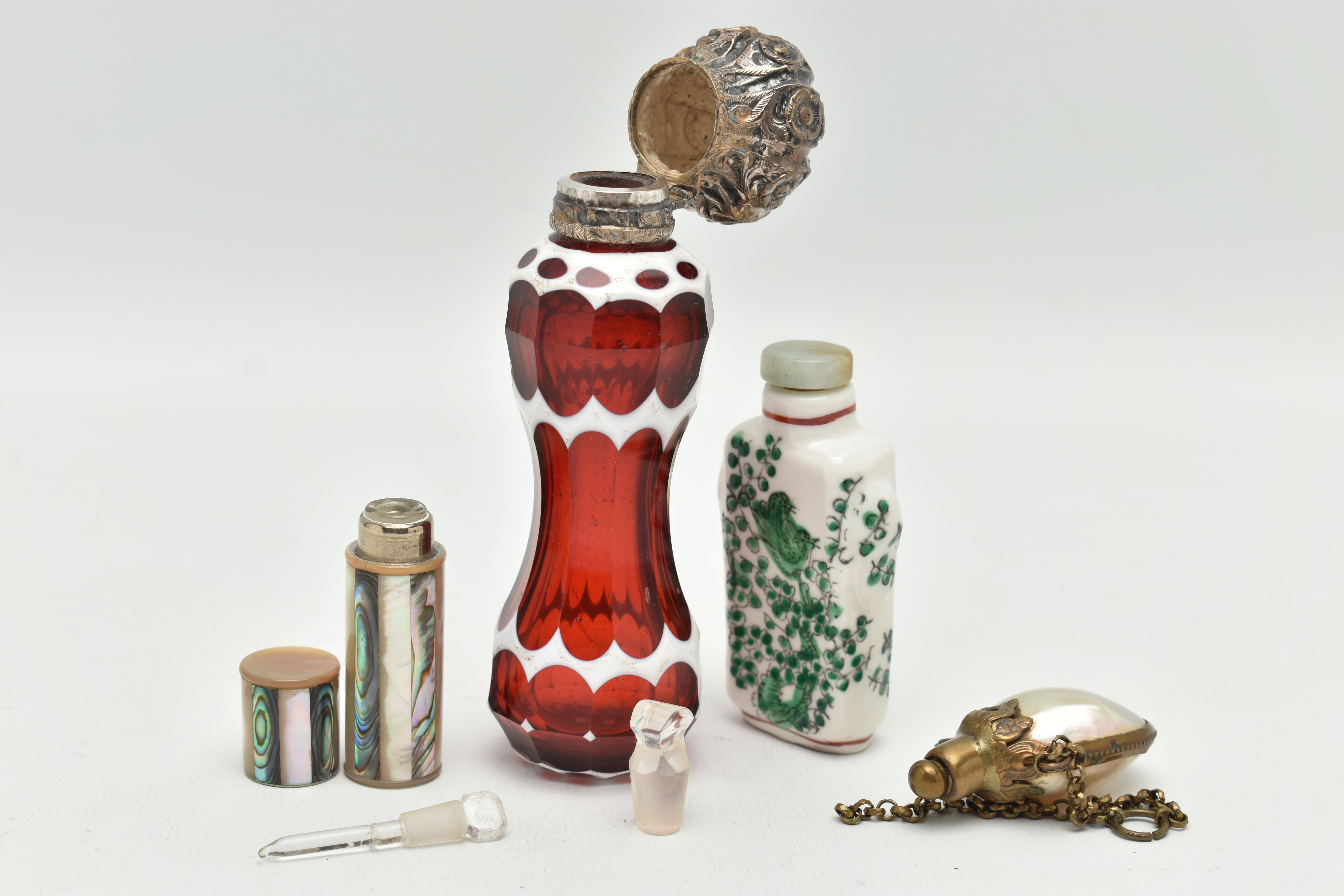 FOUR SCENT BOTTLES, to include a red and white glass scent bottle of waisted form with white metal - Image 3 of 3