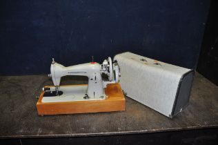 A FRISTER & ROSSMAN MODEL 25 MANUAL SEWING MACHINE with cover (handle to top missing)
