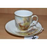 A ROYAL WORCESTER 'MAPLE' CABINET CUP AND SAUCER BY HARRY STINTON, painted with stags in a