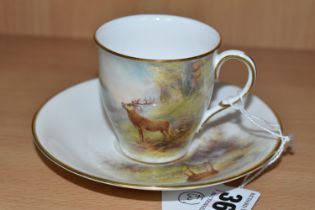 A ROYAL WORCESTER 'MAPLE' CABINET CUP AND SAUCER BY HARRY STINTON, painted with stags in a