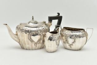 AN EARLY 20TH CENTURY, SILVER TEA SET, comprising of a teapot, sugar bowl and milk jug, each with
