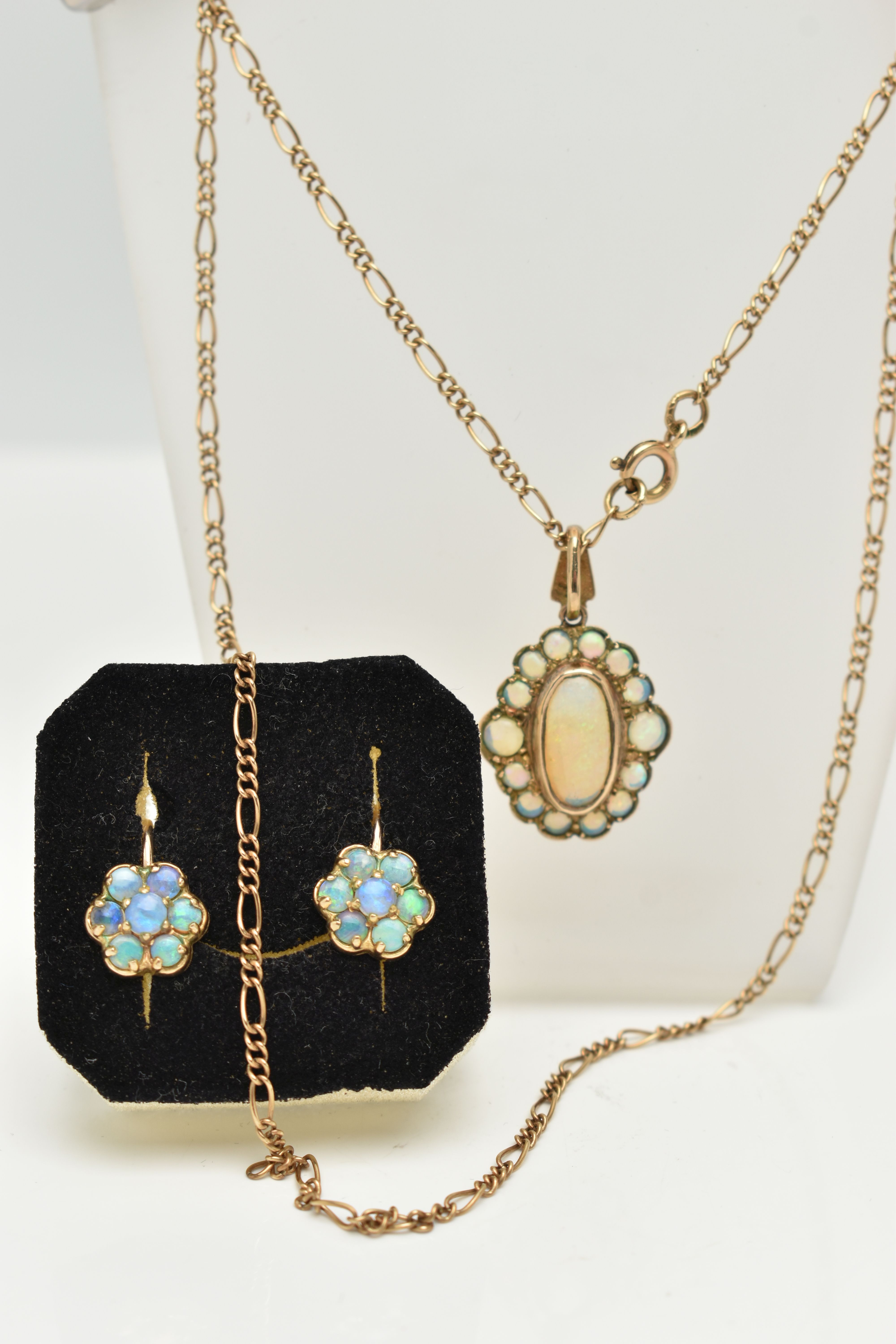 A 9CT OPAL PENDANT NECKLACE AND PAIR OF EARRINGS, the pendant set with a central oval opal