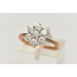 A 9CT GOLD CLUSTER RING, seven circular cut cubic zirconia, prong set in white gold, leading onto