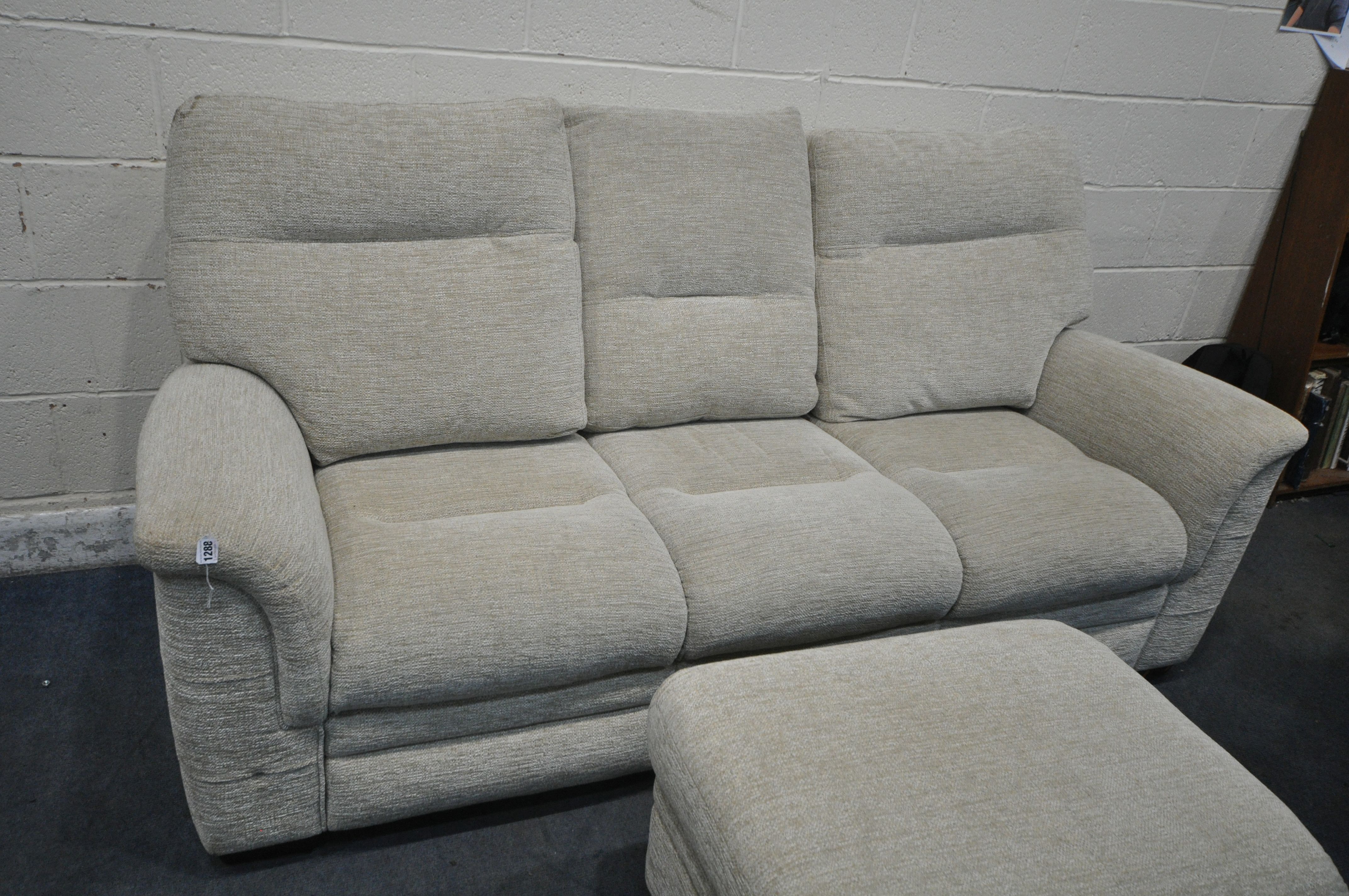 A CREAM UPHOLSTERED PARKER KNOLL THREE SEATER SOFA, length 206cm, and a matching footstool ( - Image 2 of 2