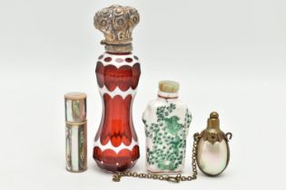 FOUR SCENT BOTTLES, to include a red and white glass scent bottle of waisted form with white metal