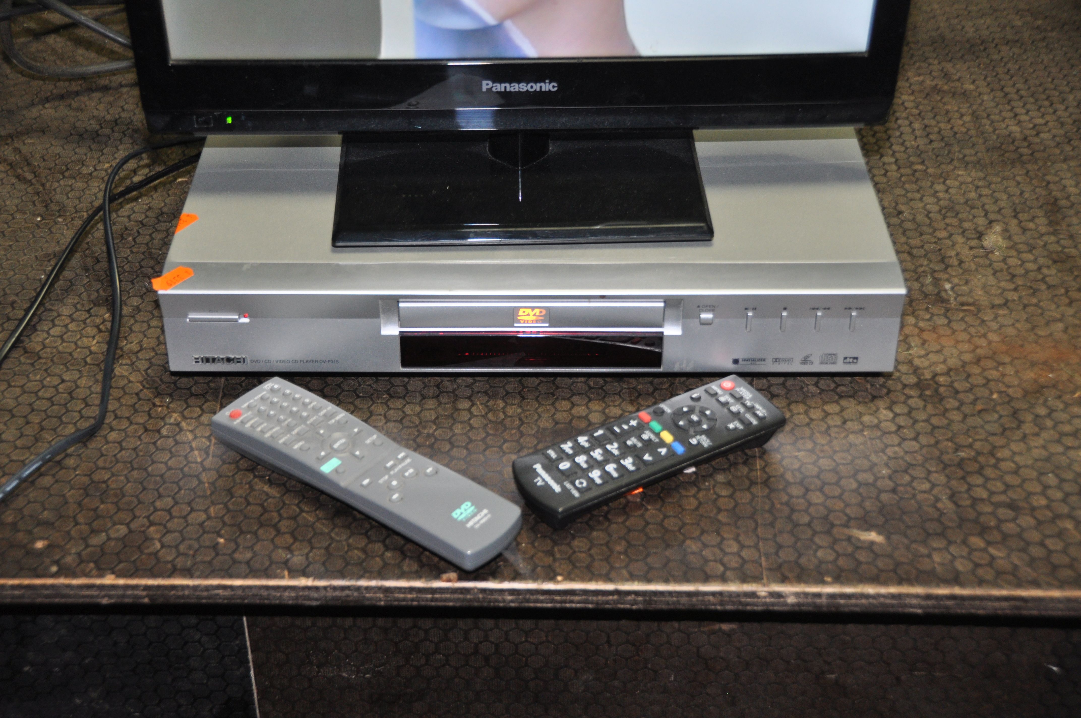 A PANASONIC TX-L19XM6B 19in TV WITH REMOTE and a Hitachi DVD player with remote (both PAT pass and - Image 2 of 2
