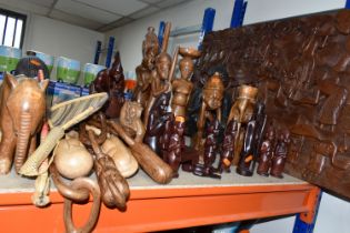 A LARGE COLLECTION OF HAND CRAFTED AFRICAN WOOD STATUES FROM LIBERIA ETC, including a large panel