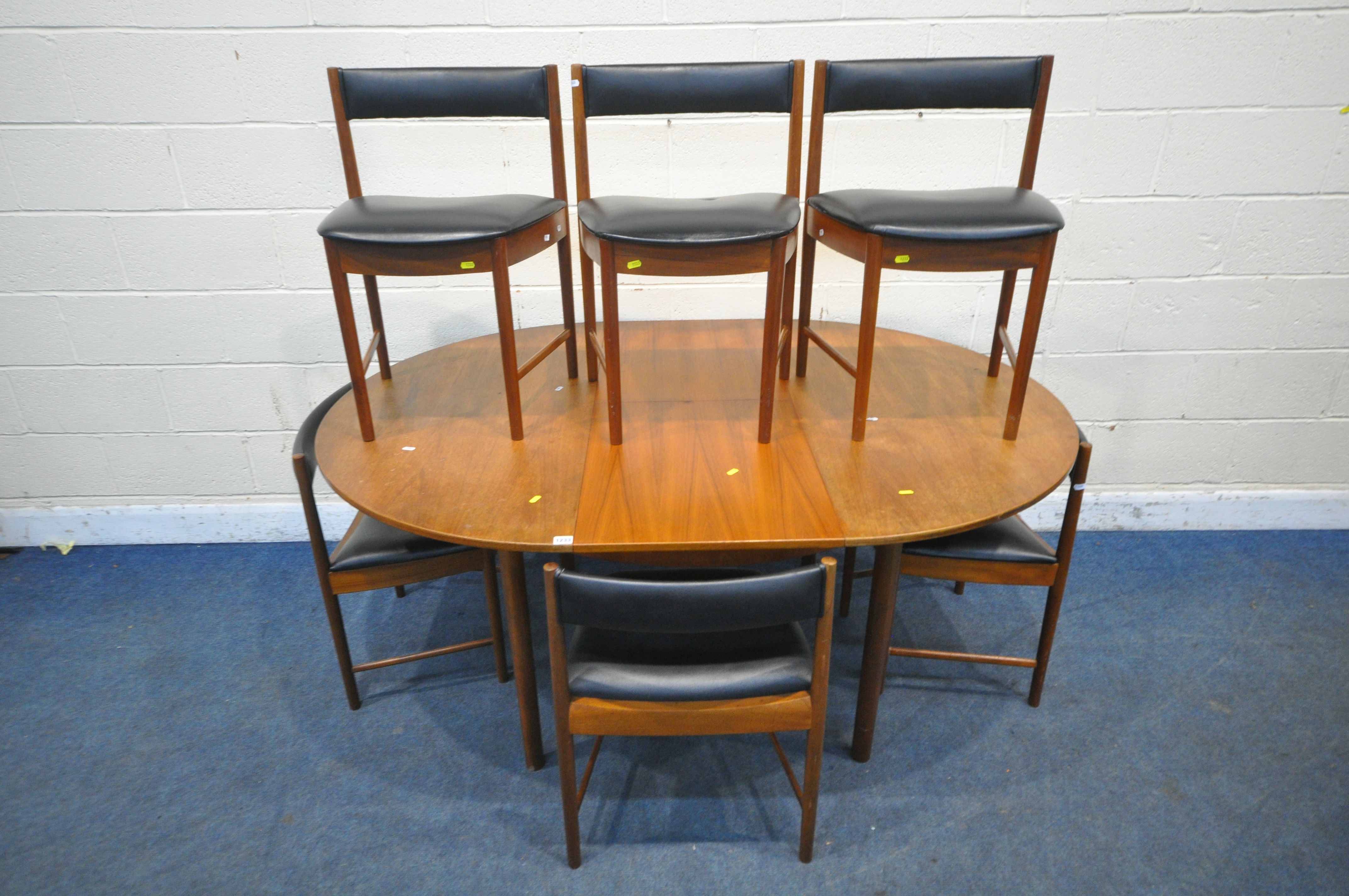 A.H. MCINTOSH AND CO LTD, KIRKCALDY, SCOTLAND, A MID CENTURY TEAK EXTENDING DINING TABLE, with a
