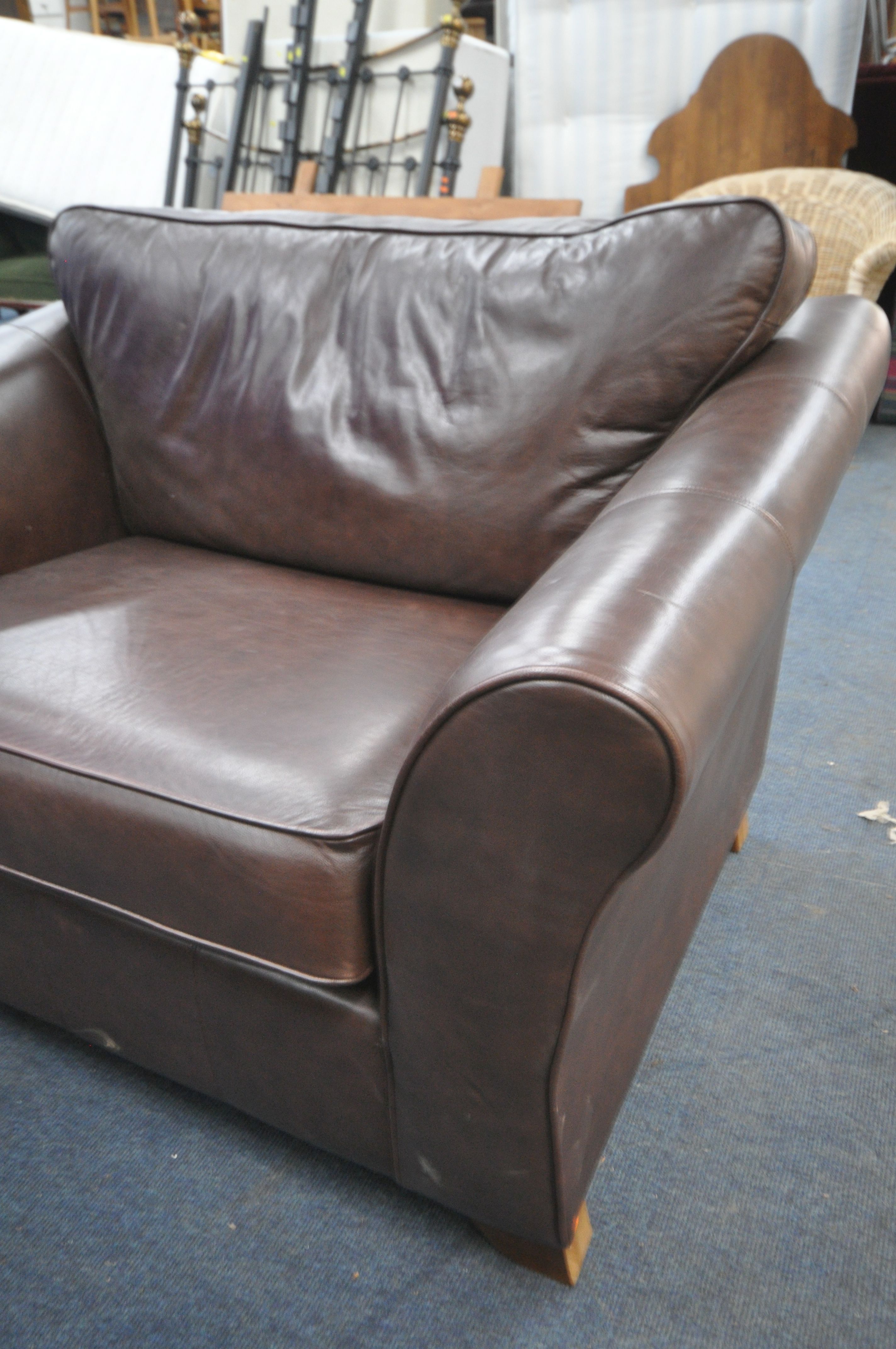 A WIDE BROWN LEATHER ARMCHAIR, width 137cm x depth 100cm, and a Parker Knoll grey leather - Image 2 of 4