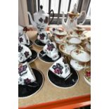 TWO ROYAL ALBERT PORCELAIN PART TEA SETS IN 'MASQUERADE' AND 'OLD COUNTRY ROSES' PATTERNS, including