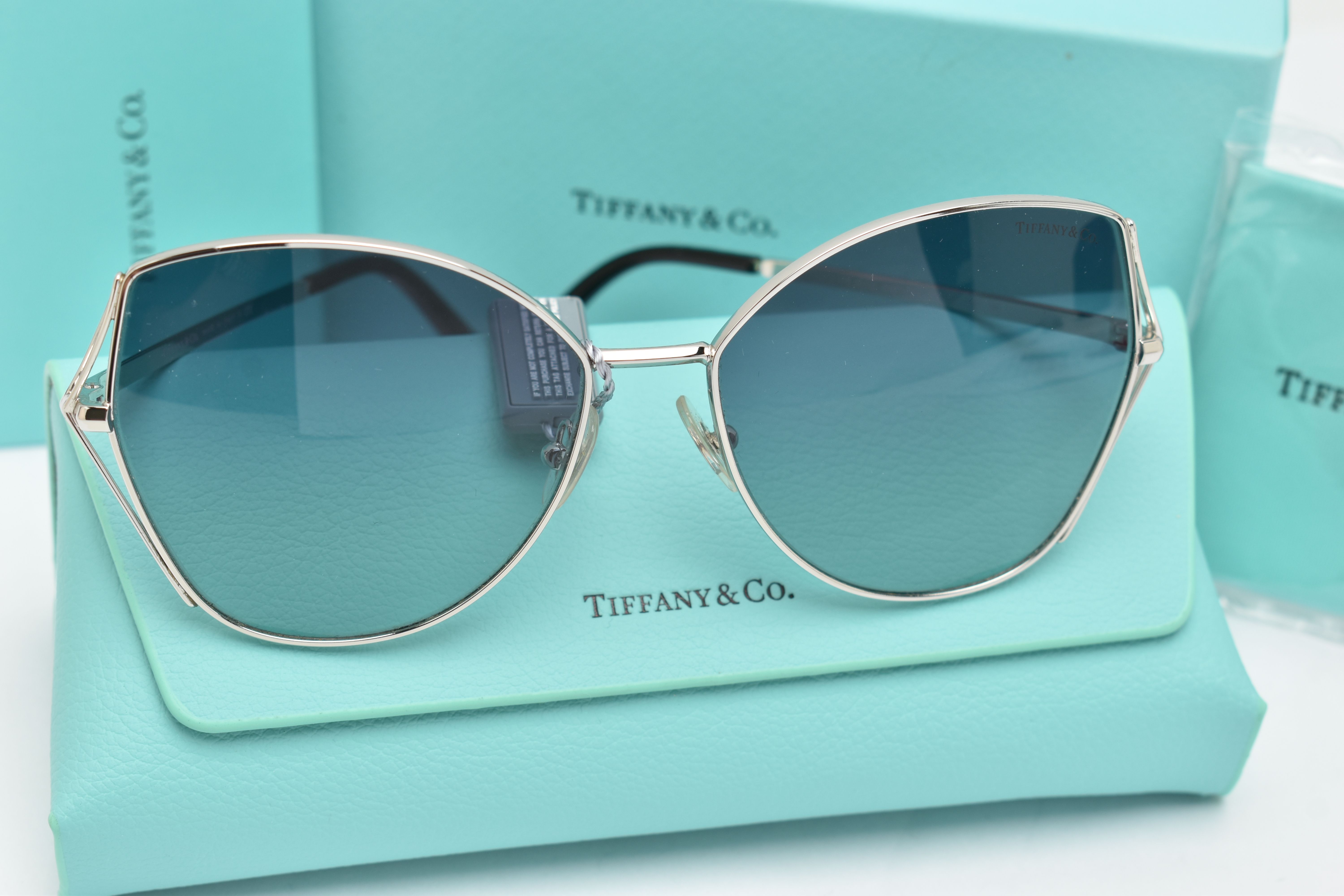 A PAIR OF 'TIFFANY & CO' SUNGLASSES, a pair of butterfly style TF3072 sunglasses, together with