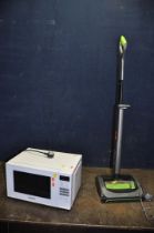 A G TECH AIRRAM CORDLESS VACUUM CLEANER and a Panasonic microwave (both PAT pass and working)