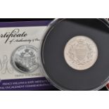 A CASED 'PRINCE WILLIAM AND KATE MIDDLETON ROYAL ENGAGEMENT COMMEMORATIVE ISSUE' FIVE POUND COIN,