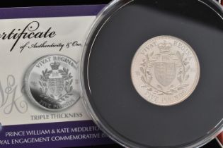 A CASED 'PRINCE WILLIAM AND KATE MIDDLETON ROYAL ENGAGEMENT COMMEMORATIVE ISSUE' FIVE POUND COIN,