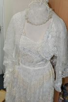 A 1970'S STYLE BESPOKE SLEEVELESS WEDDING DRESS, off white/cream coloured with Bolero jacket and