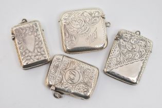 FOUR LATE 19TH TO EARLY 20TH CENTURY SILVER VESTAS, all with engraved foliate decoration, two with