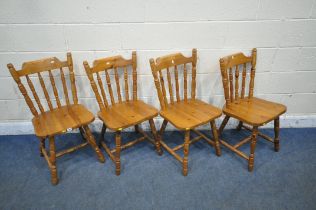 A SET OF FOUR PINE SPINDLE BACK KITCHEN CHAIRS (condition report: slight wobble to a couple of