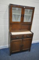 NEATETTE, A MID CENTURY OAK KITCHENETTE, fitted with double glazed doors, double sliding doors, a