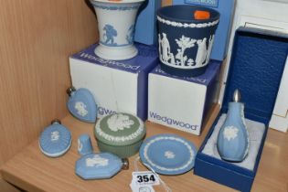 A GROUP OF WEDGWOOD JASPERWARE, ten pieces comprising two boxed vases, four scent bottles - of which