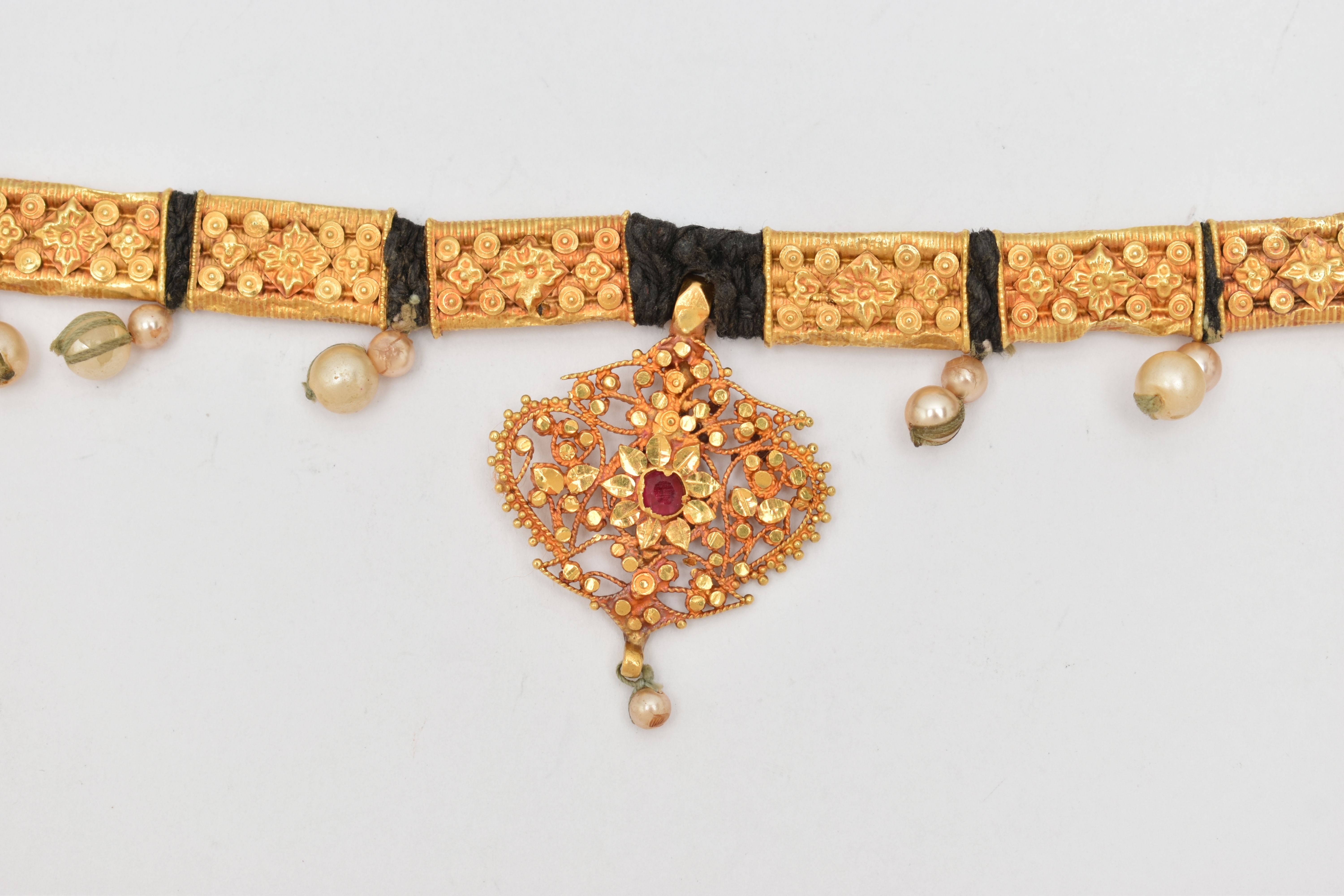 AN INDIAN NECKLACE, designed with a central fancy floral and beaded pendant with central ruby - Image 2 of 8