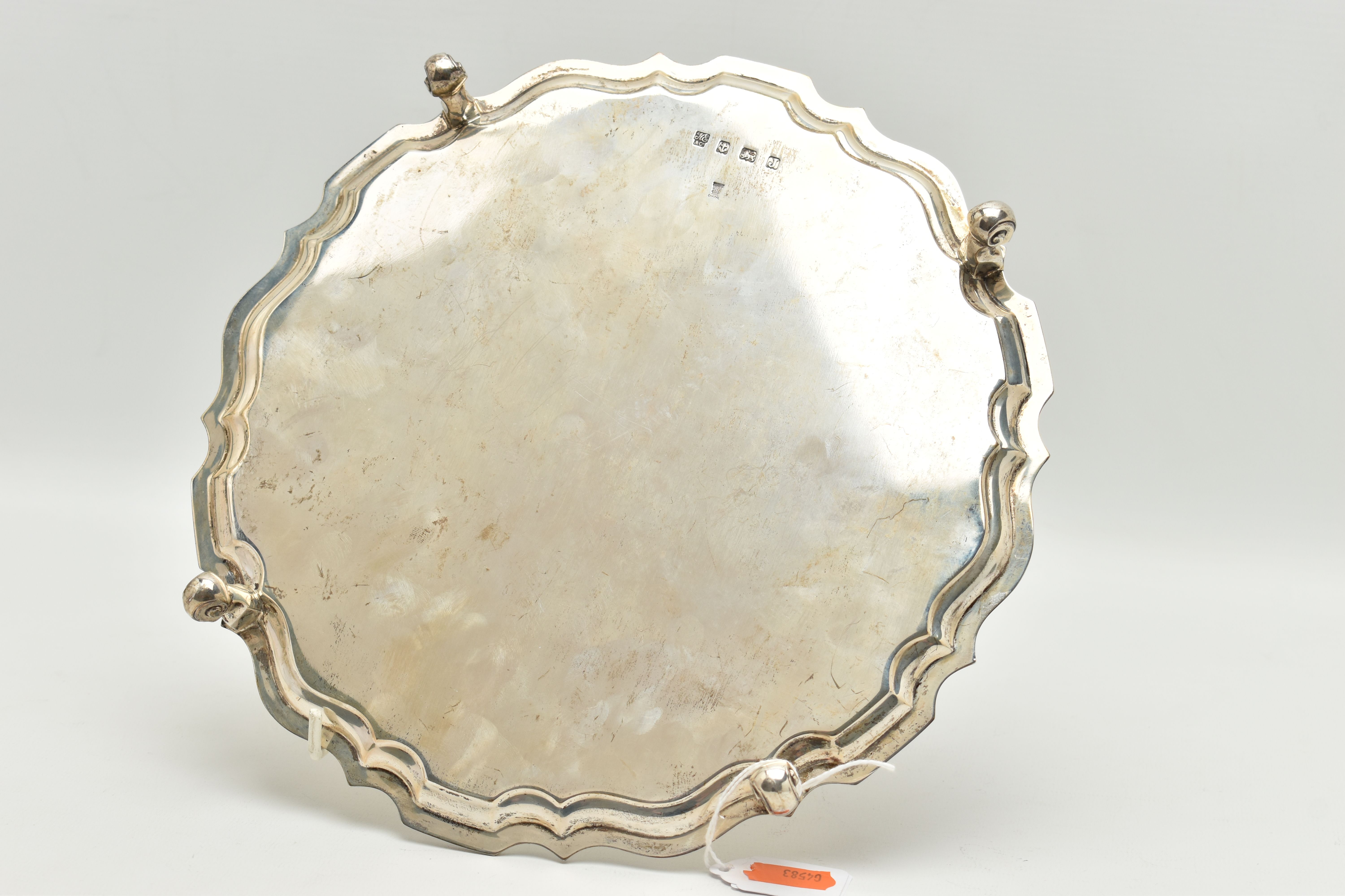A GEORGE V SILVER SALVER, a circular form salver with a fluted border, raised on four scrolled feet, - Image 3 of 6