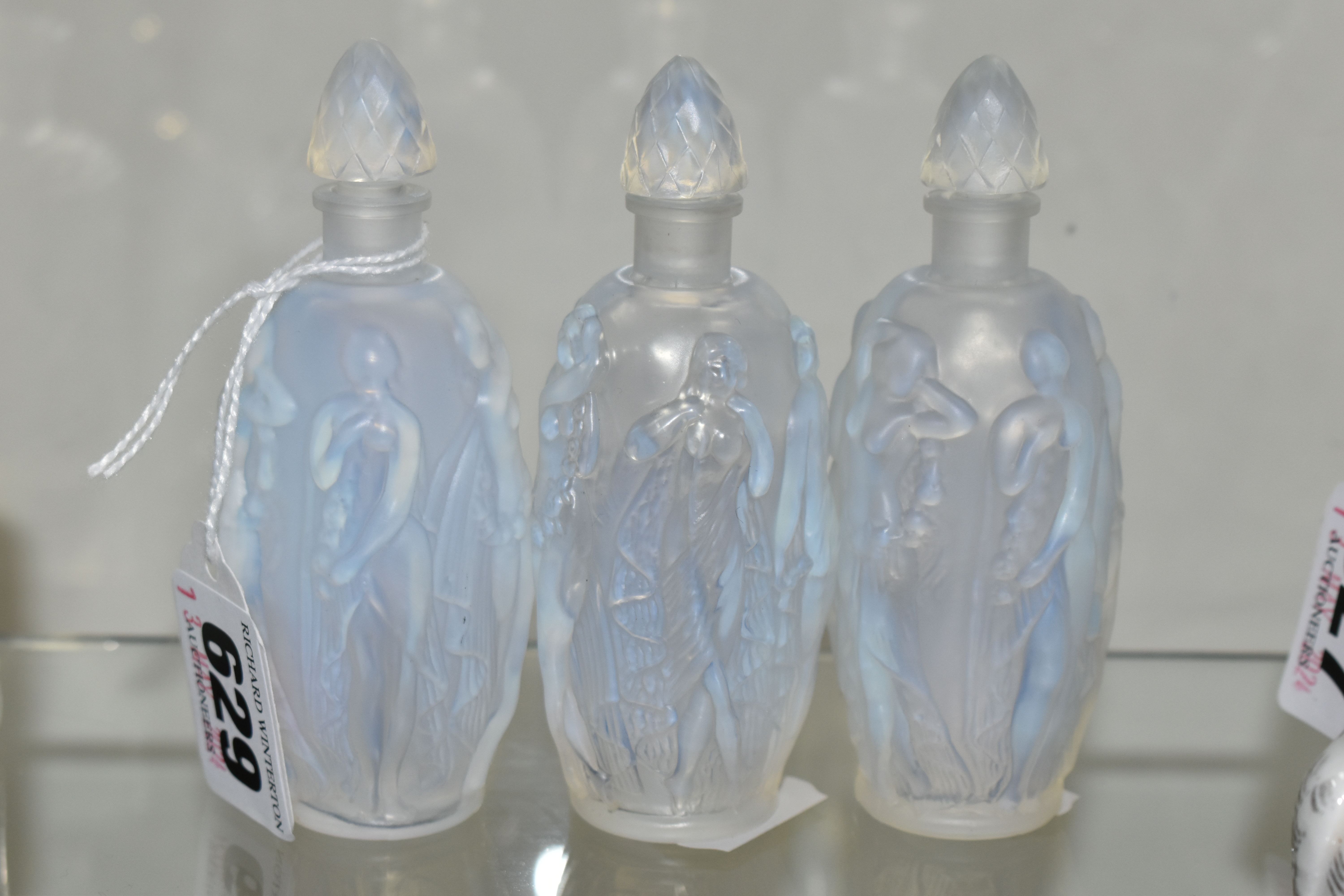 THREE SABINO OPALESCENT SCENT BOTTLES, each having the same moulded design of Neo-Classical female