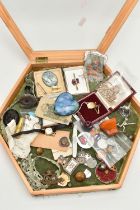 A BOX OF ASSORTED ITEMS, a hexagonal wooden and glass lidded display box with green fabric interior,