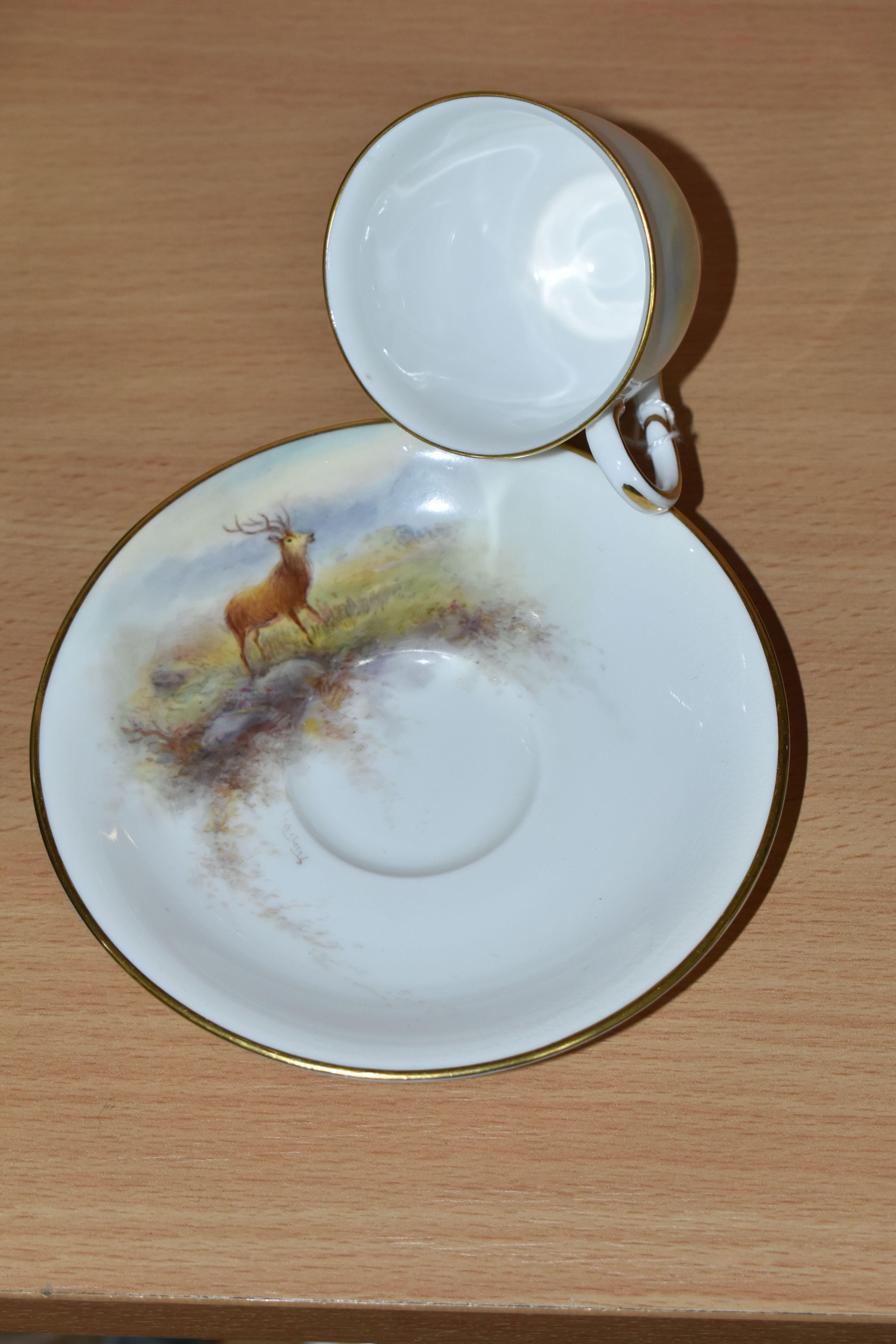 A ROYAL WORCESTER 'MAPLE' CABINET CUP AND SAUCER BY HARRY STINTON, painted with stags in a - Image 3 of 5