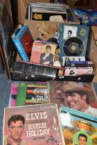 TWO BOXES OF ELVIS PRESLEY LP RECORDS, FILMS AND MEMORABILIA, to include a framed collector's