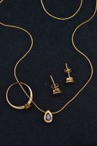 A MODERN 9CT YELLOW GOLD IOLITE EARRRING, NECKLACE AND RING SET, the necklace set with a pear-cut