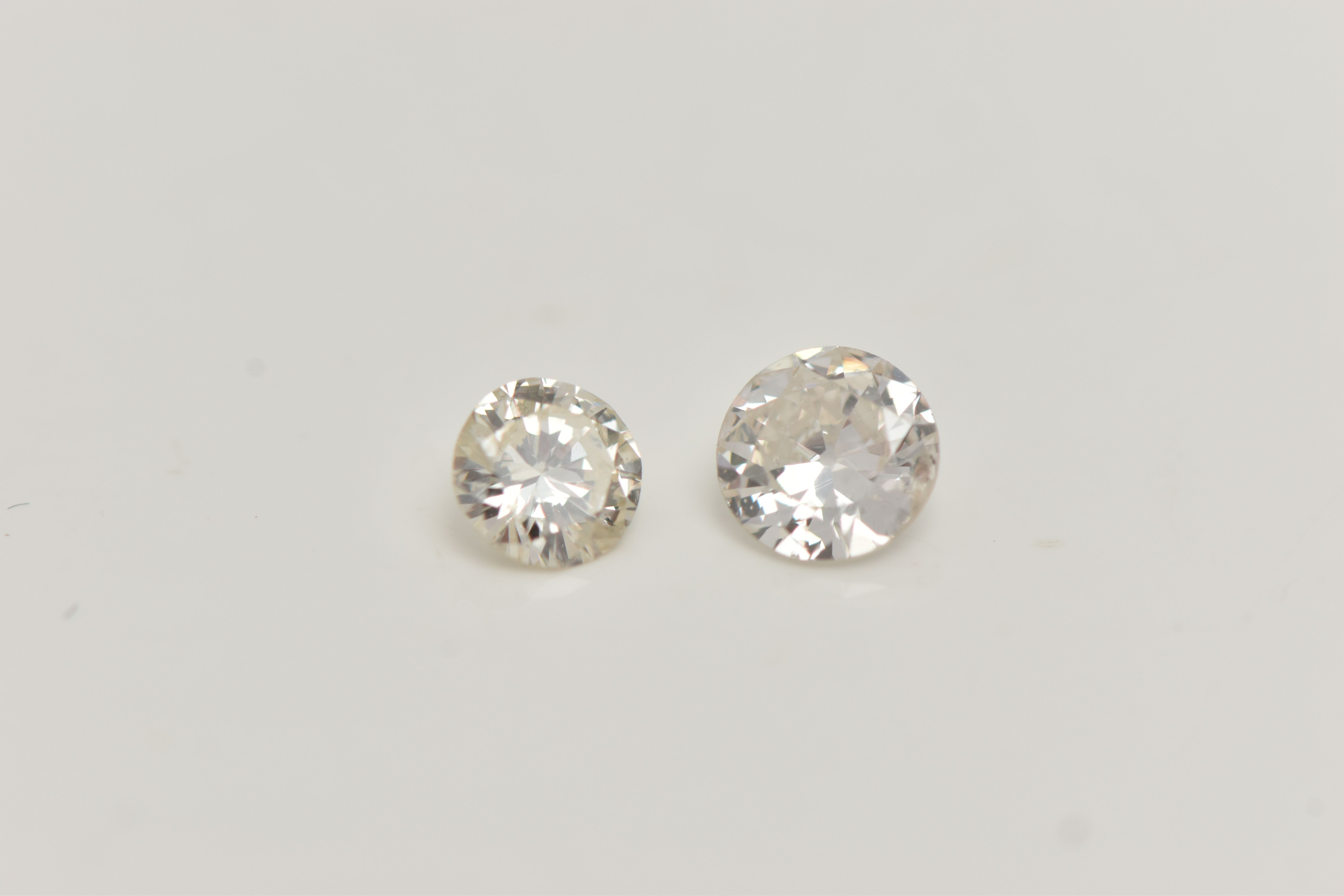 TWO LOOSE DIAMONDS, the first a round brilliant cut diamond, approximate diamond weight 0.23ct,