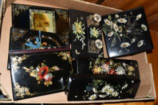 A BOX OF DECORATED PAPIER MACHE ITEMS, seven pieces to include blotters, glove boxes and a desk