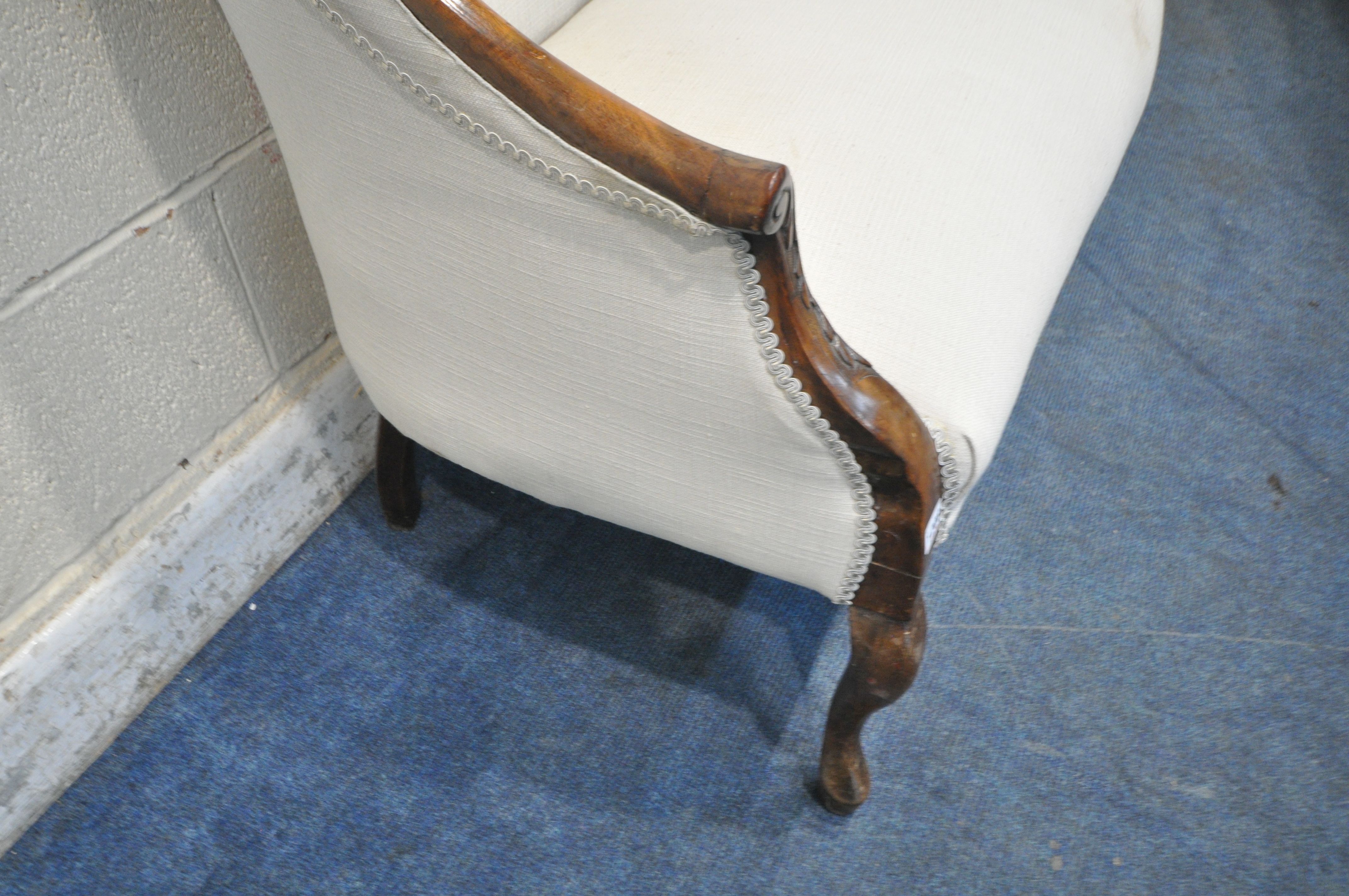 A VICTORIAN MAHOGANY SOFA, one side of backrest higher than the other, with a scrolled crest, closed - Image 4 of 5
