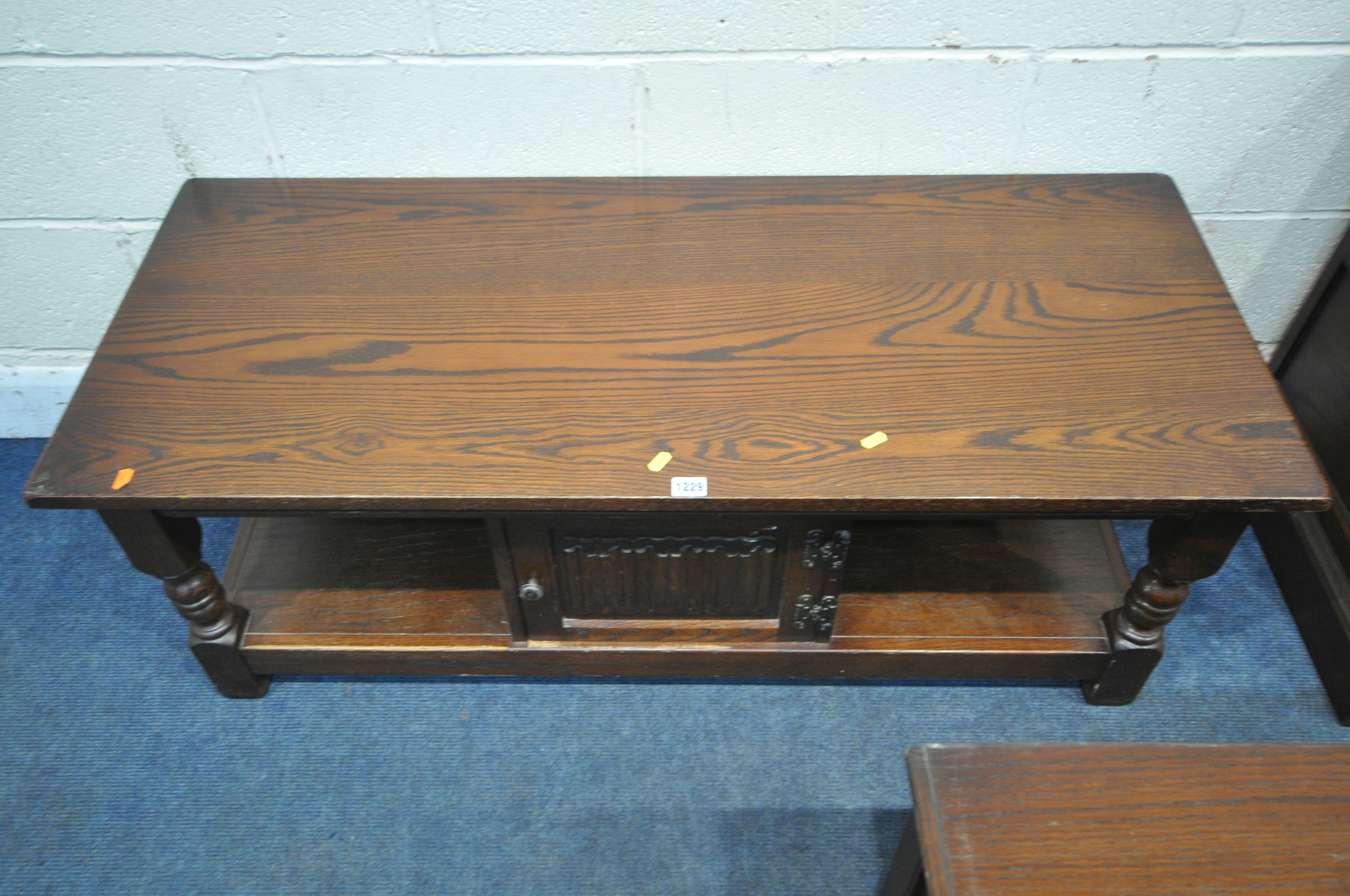 AN OLD CHARM OAK COFFEE TABLE, with a single linenfold door, width 122cm x depth 51cm x height 47cm, - Image 2 of 3