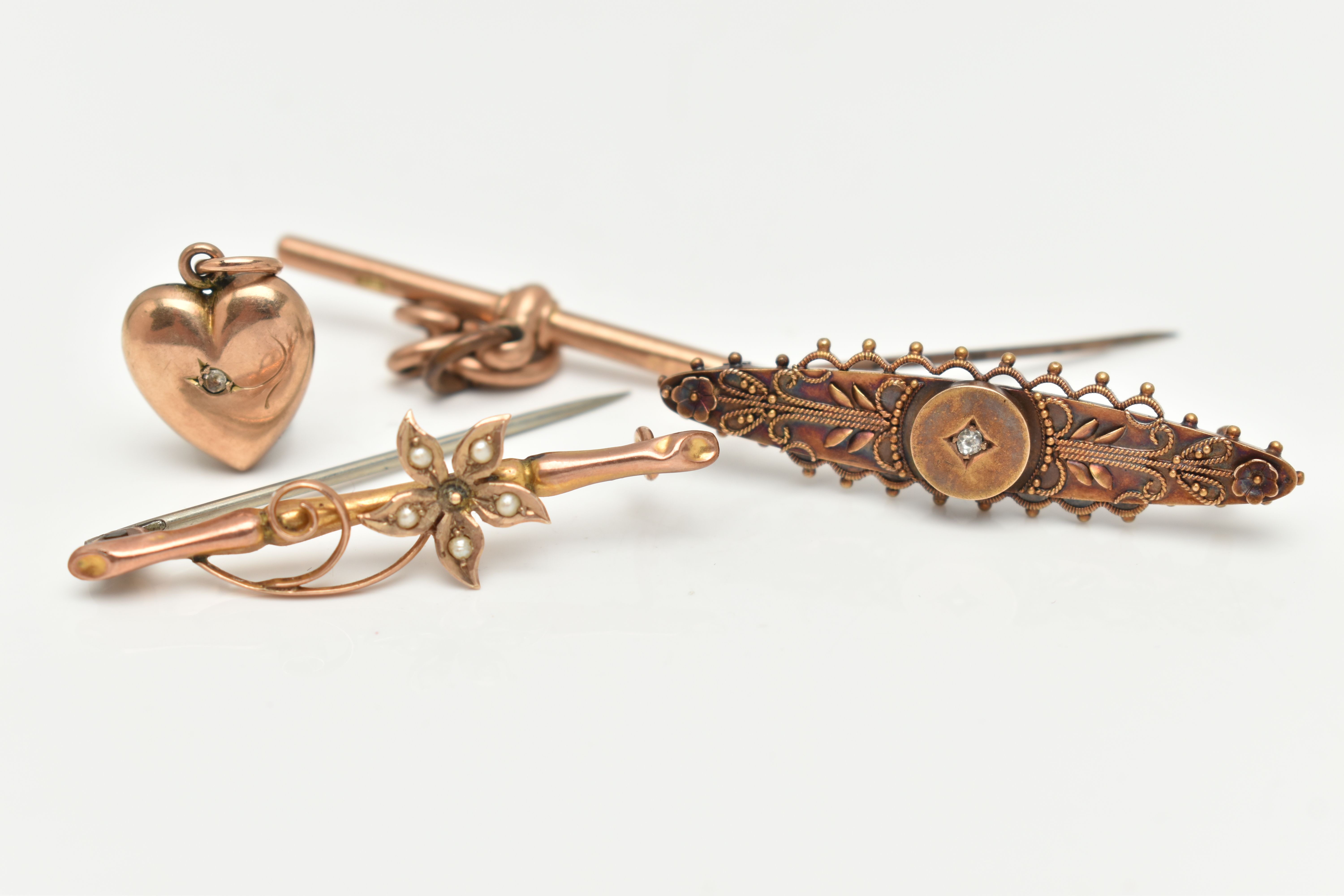 TWO BAR BROOCHES, A T-BAR AND A HEART PENDANT, to include an Etruscan style brooch set with a