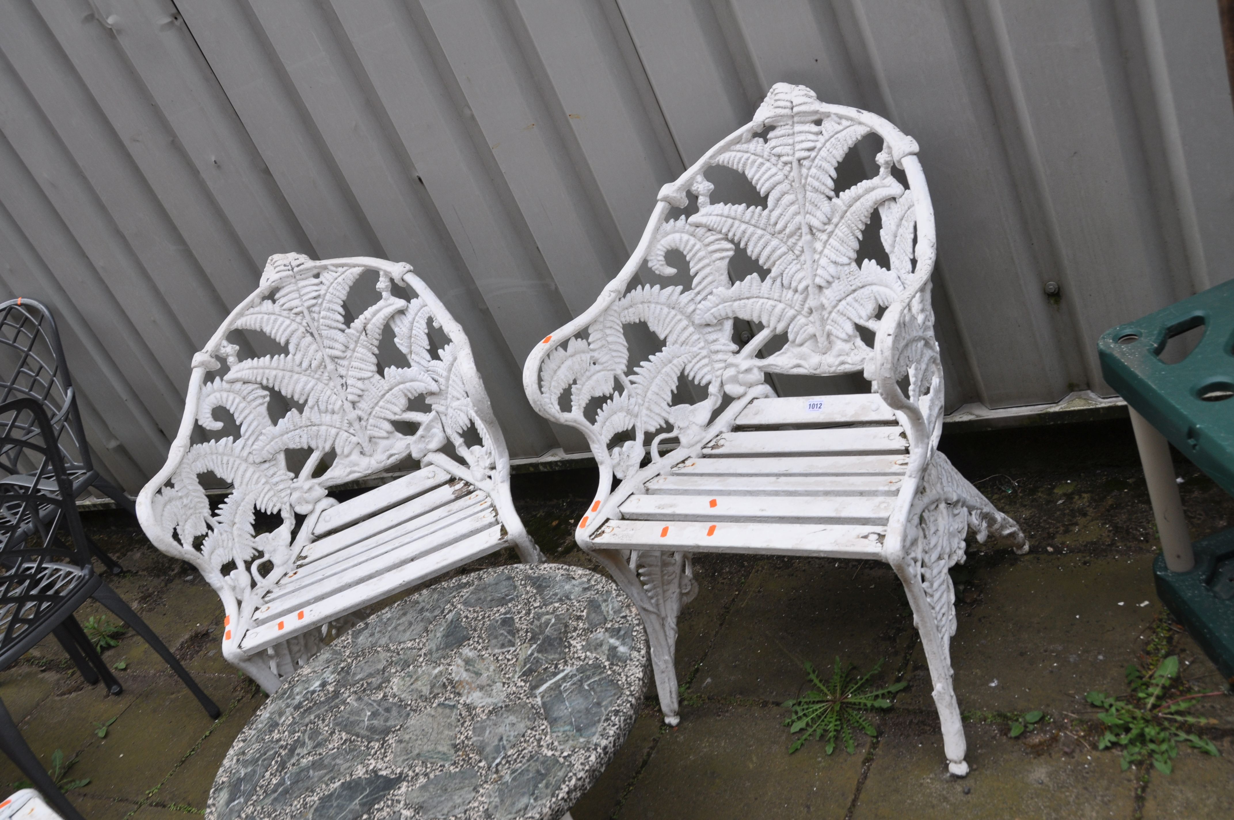 A LATE 20TH CENTURY CAST ALUMINIUM GARDEN SET comprising of a three seat bench and two matching - Image 4 of 4