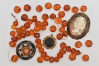 A SELECTION OF LOOSE AMBER BEADS AND THREE EARLY TO MID 20TH CENTURY ITEMS, to include approximately