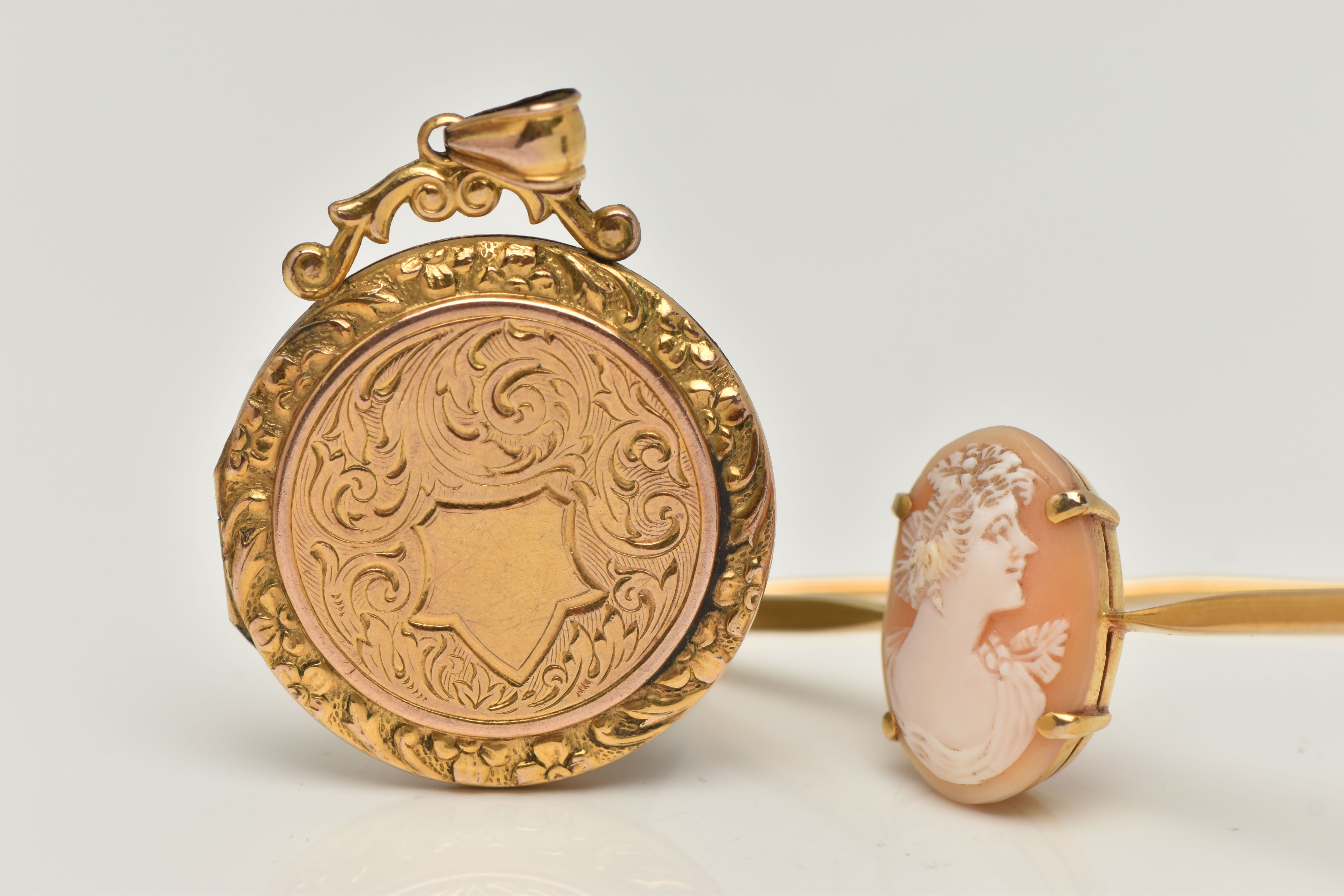 A CAMEO BROOCH AND A LOCKET, carved oval shell cameo depicting a lady in profile, four claw set, - Image 2 of 3