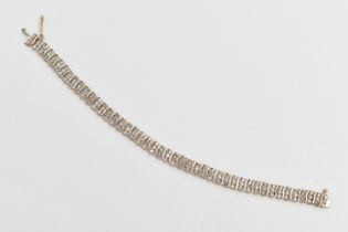 A 9CT GOLD DIAMOND BRACELET, designed as a series of single-cut diamonds, interspaced by plain